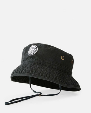 The Rip Curl Wetsuit Icon Mid Brim Hat is black with a chin strap, metal side eyelets, and a round white embroidered patch of the Wetsuit Icon on the front. Shown against a plain white background.