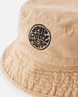 Close-up of the Rip Curl Wetsuit Icon Mid Brim Hat in beige, showcasing its black embroidered "RIP CURL WETSUITS" circular Wetsuit Icon logo on the front.