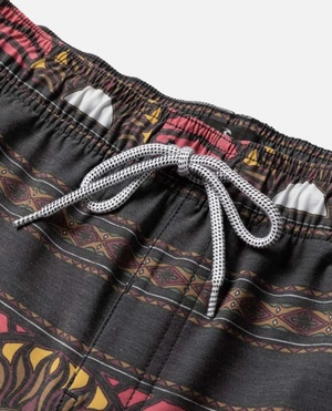 Close-up of the Rip Curl Party Pack Volley shorts' waistband, with a black and white drawstring and bold geometric tribal-inspired red, yellow, and brown design. Made with quick-dry fabric for all-day comfort.