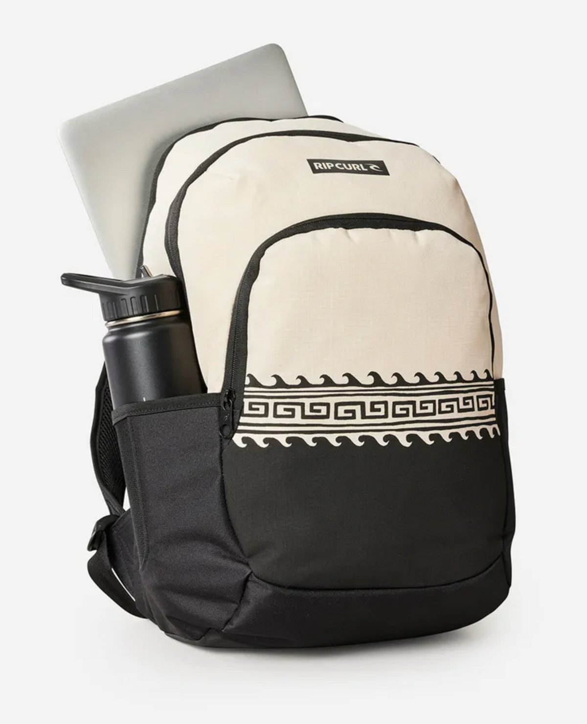 The Rip Curl Ozone 2.0 30L Backpack, in black and cream recycled polyester, showcases a black geometric pattern on the front. It includes a laptop in the main compartment, a black water bottle in the side pocket, and prominently displays the brand logo on the top front pocket.