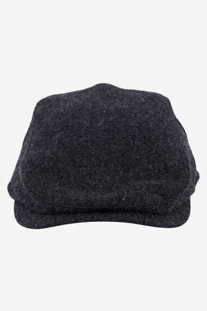 A trio of Swanndri Bristol Flat Caps in dark grey, ideal for outdoor adventures, is stylishly stacked against a white backdrop.