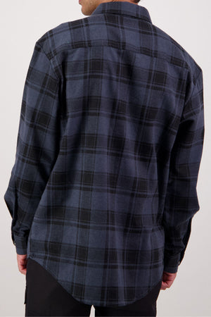 A person is shown from the back wearing a relaxed-fit Swanndri Egmont Flannelette Twin Pack shirt, featuring long sleeves and a dark blue and black plaid pattern in soft brushed cotton. Their arms are at their sides.