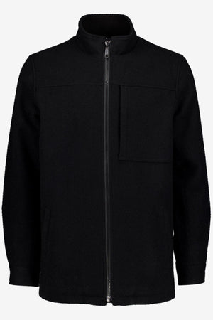The Swanndri Hudson Jacket is a black zip-up with high collar, long sleeves, and premium New Zealand wool. Its minimalist design includes a vertical zipper and two pockets—ideal for stylish outdoor wear.