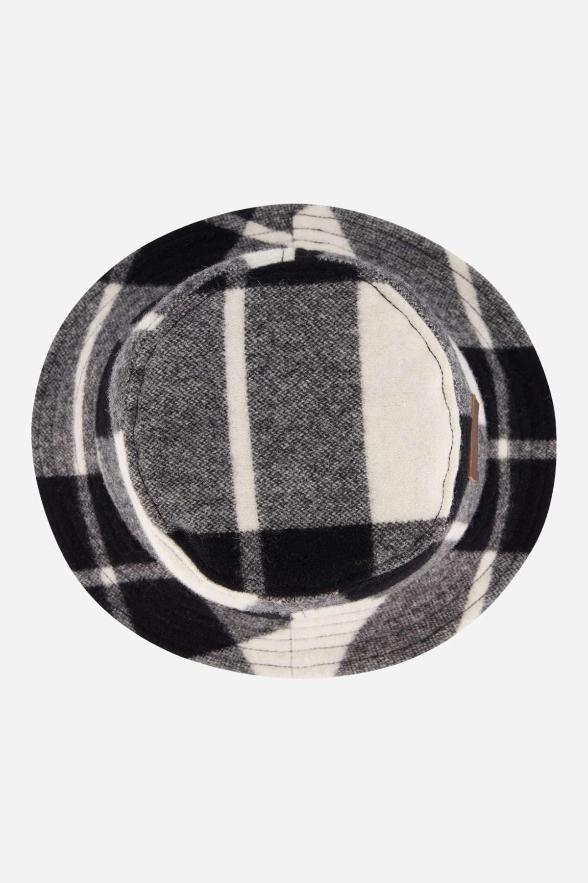 The Swanndri Kaimai Wool Bucket Hat features a round, flat brim and a black, white, and gray plaid pattern—shown from above on a plain white background—making it ideal for outdoor adventures.