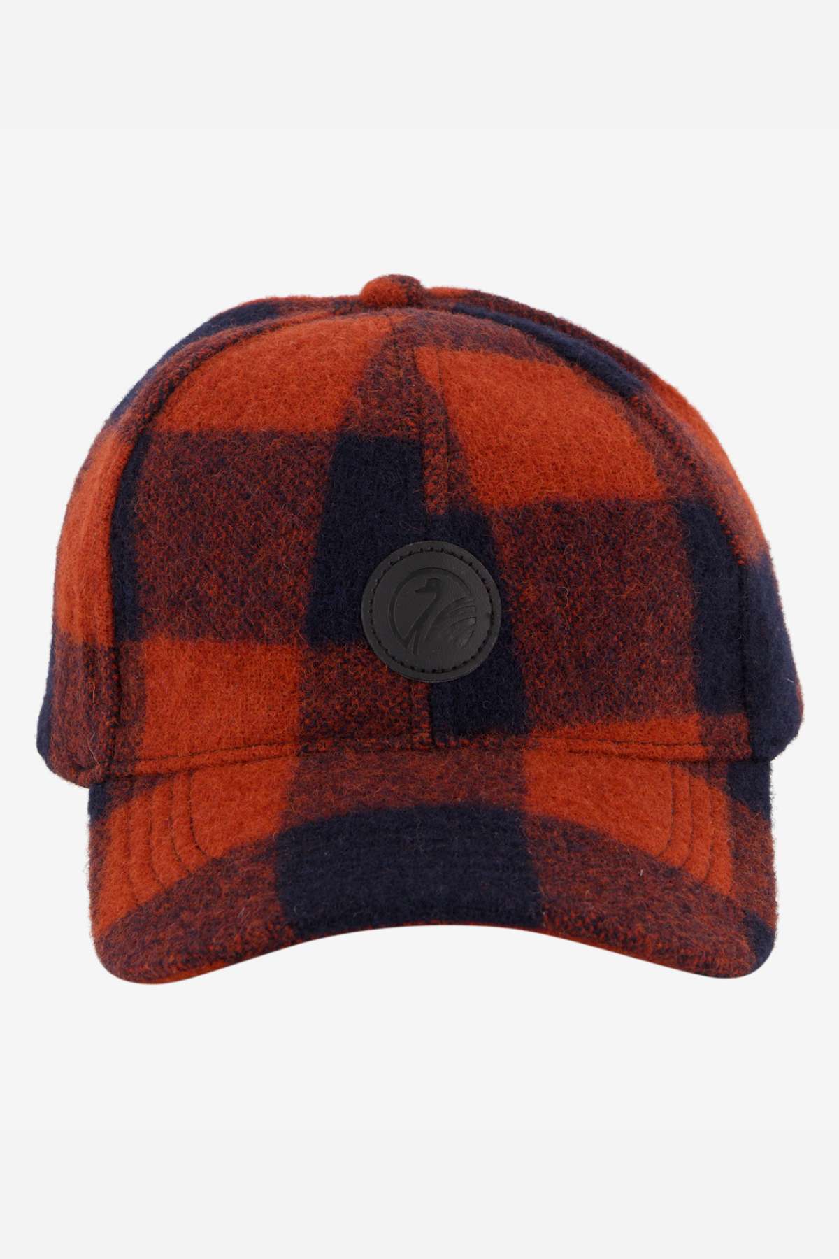 The Swanndri Swanni Wool Check Baseball Cap features a red and black plaid design, a round black front patch, adjustable fit, and is shown against a plain white background.