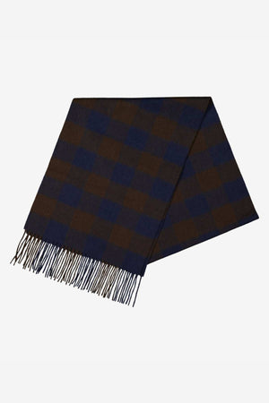 The Swanndri The Scarfie is a brushed wool scarf with a navy and brown checkered pattern and fringed ends, laid flat on a white background—an ideal cold weather accessory for warmth and comfort.