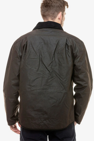 A man is seen from behind wearing the Swanndri Waimak Oilskin Jacket, a dark, collared design with a slightly wrinkled finish. His arms rest at his sides against a plain white background.