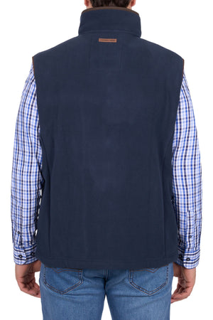 A person shown from the back against a white background wears a blue checkered shirt, blue jeans, and the Thomas Cook Adrian Vest in navy.