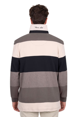 A person is seen from behind wearing the Thomas Cook Brandon Rugby, a long-sleeve shirt with wide beige, gray, and black stripes and a high collar featuring embroidered cursive text.
