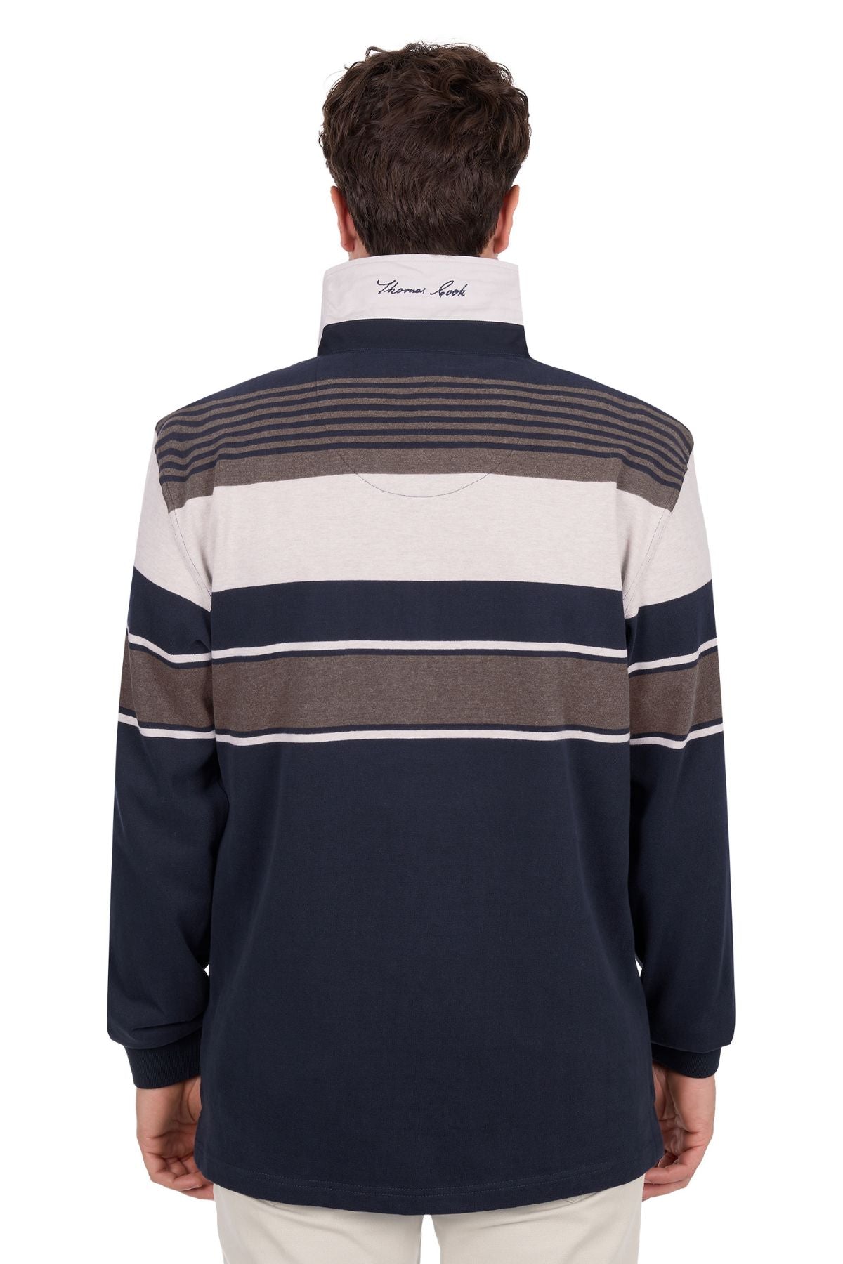 A man with short brown hair is seen from behind wearing the Thomas Cook Bryan Stripe Rugby—a long-sleeve, collared pullover featuring navy, white, and brown horizontal stripes with an upturned collar showing embroidered text.