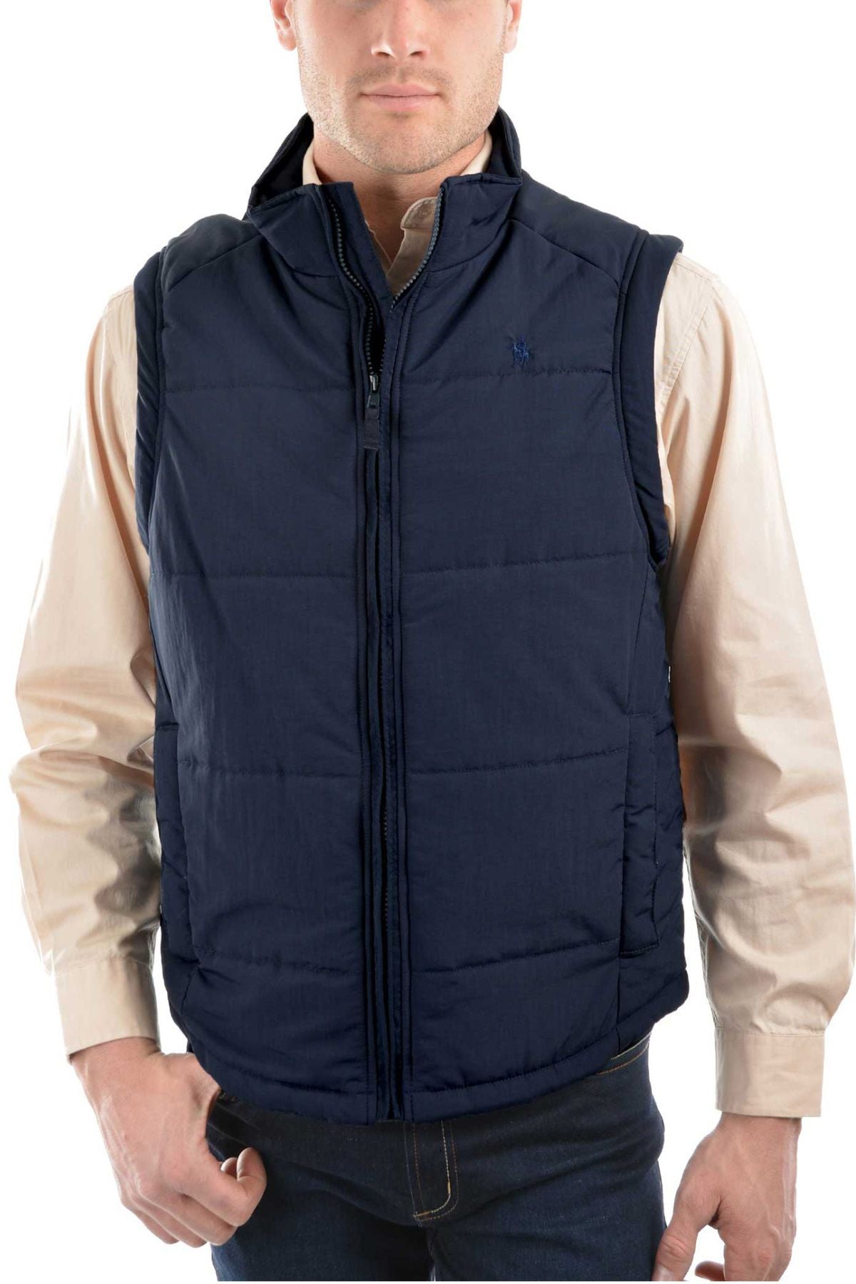 A man faces forward, his left hand in his pocket, wearing a beige button-up shirt and the Thomas Cook Hawkesbury River Vest with polar fleece-lined pockets in navy blue.
