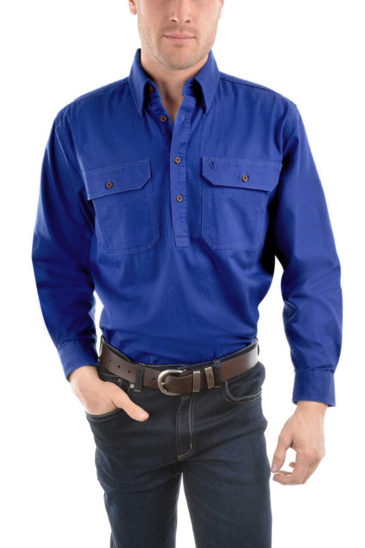 A person wearing a bright blue Thomas Cook Heavy Drill Half Placket Shirt with two front pockets, paired with dark jeans and a black belt, stands against a plain white background.