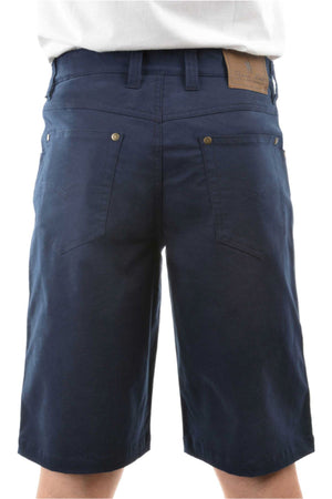 Someone is seen from the back wearing dark blue Thomas Cook Jake Comfort Waist Shorts, featuring stretch fabric, back pockets, belt loops, and a brown leather patch on the waistband.