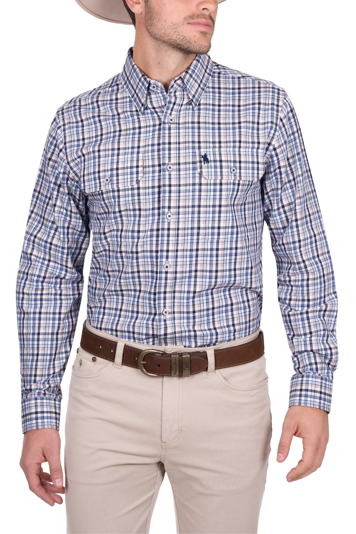 A man wears a beige cowboy hat, Thomas Cook Patrick Shirt (blue and white plaid), brown belt, and light pants, standing with arms relaxed at his sides against a white background.