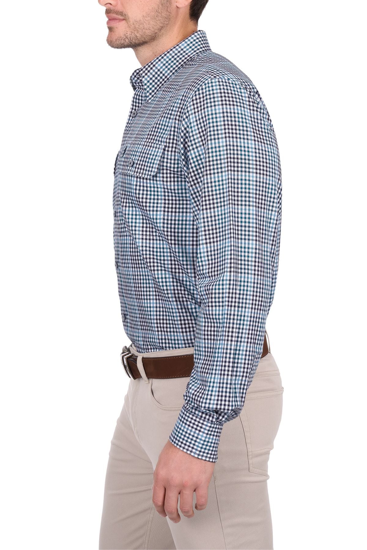 A man in a blue and white checked Thomas Cook Stephen Shirt, tan pants, and a brown belt stands in profile against a white background.