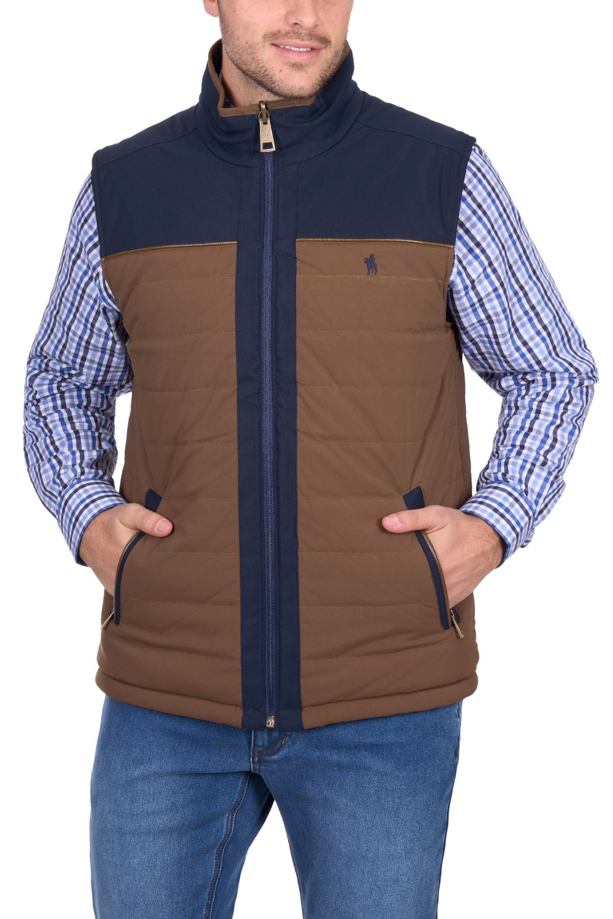 A man wears the Thomas Cook Toby Revs Vest, blue and brown, over a blue plaid shirt with blue jeans, standing hands in vest pockets, facing forward.