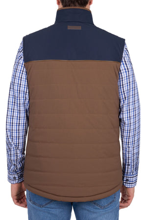 A person wearing the Thomas Cook Toby Revs Vest over a blue and white plaid shirt with blue jeans, shown from the back against a white background.