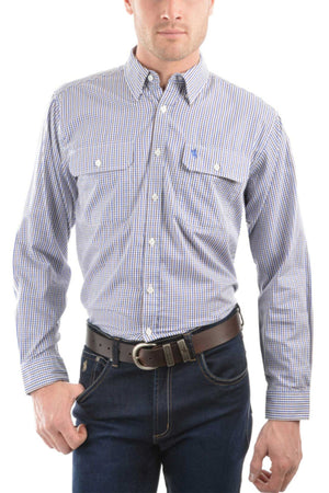 A man wears the Thomas Cook Wentworth Shirt—a blue and white plaid 100% cotton shirt with two front pockets—paired with dark blue jeans and a brown belt. His left hand is in his pocket, and his face is partially out of frame.