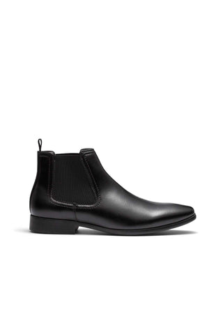 Introducing the UNcut Newlands Boot: a sleek black leather Chelsea boot with a smooth finish. It features elastic side panels, an almond toe shape, and a convenient pull tab at the back. Displayed against a white background, this versatile design is complete with a low heel and is available in UK sizing to ensure the perfect fit.