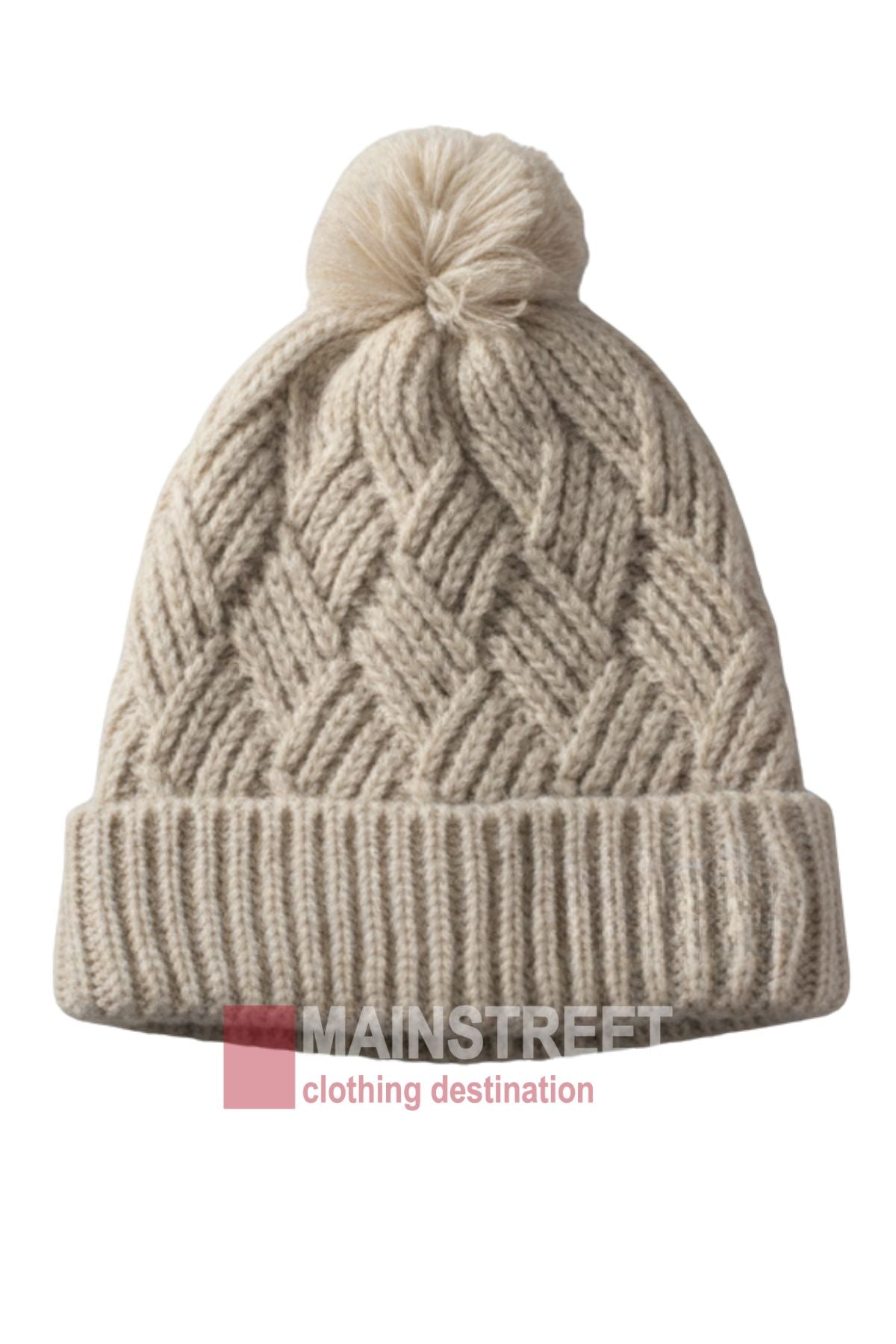 The Anticorp Ladies Herringbone Beanie is beige with a textured herringbone pattern, folded brim, and large pom-pom. "MAINSTREET clothing destination" is featured at the bottom.