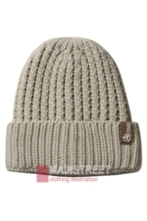 The Anticorp Ladies Ribbed Lined Beanie is beige with a folded brim and a small brown tag displaying a white logo. Soft and cozy for chilly days, it's overlaid with "MANSTREET clothing destination" at the bottom.