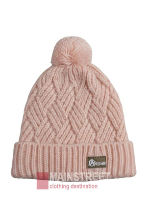 The Anticorp Ladies Herringbone Beanie is a light pink women’s beanie with a pom-pom, thick crisscross pattern, folded brim, and small logo patch. The image features a "MAINSTREET clothing destination" watermark at the bottom.