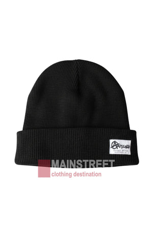 The Anticorp Mens 100% Wool Lined Beanie is a plain black beanie with a folded brim, ideal for cold Jindabyne winters. It features a rectangular white patch with black text and graphics on the front.