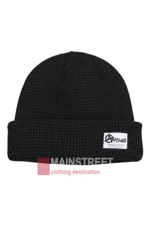 The Anticorp Mens Waffle Beanie is a black knitted hat with a folded brim and a white "ANTICORP" patch—perfect for winter. A subtle "MAINSTREET clothing destination" watermark appears at the bottom foreground.
