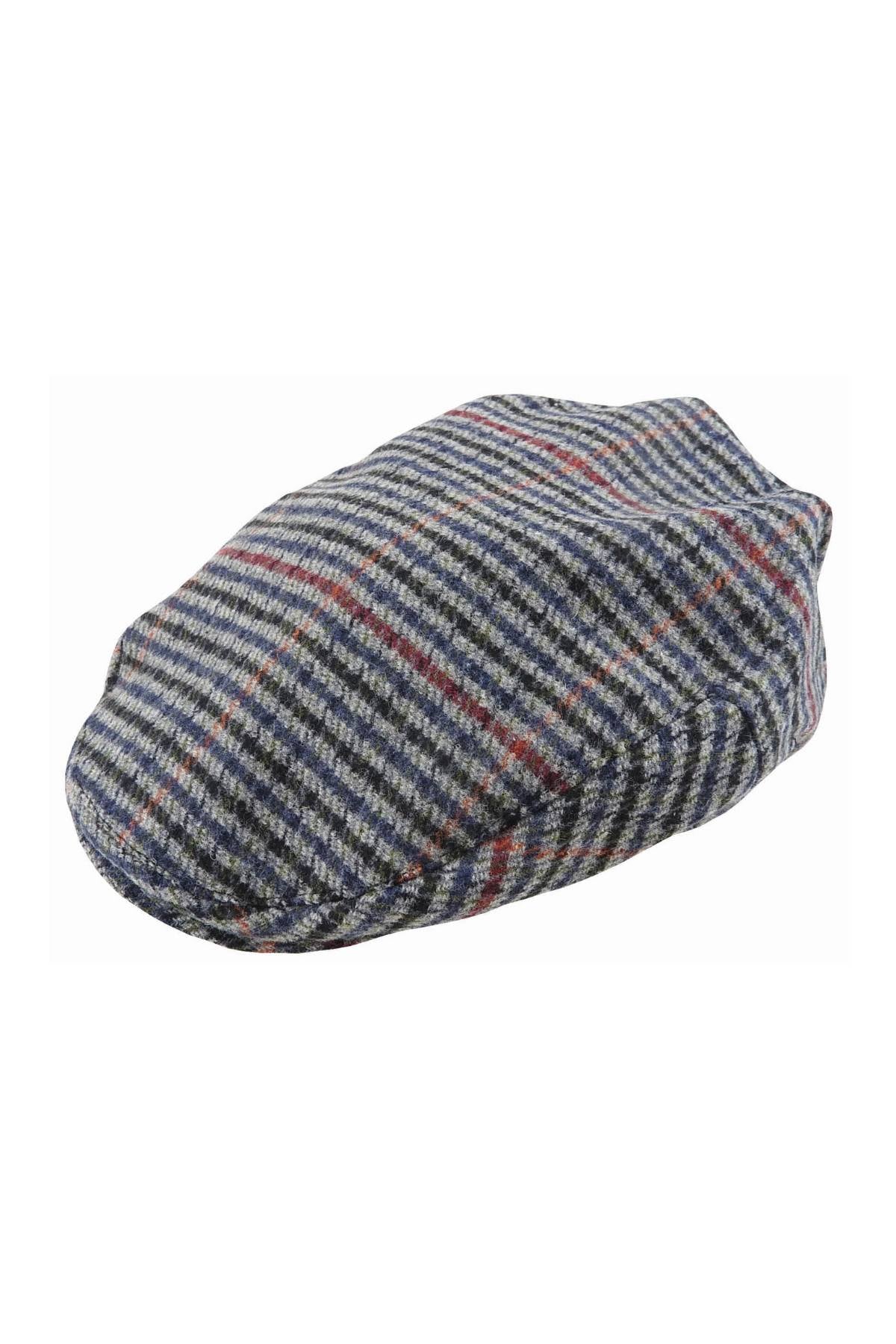 The Avenel Arlo Wool Blend Tweed Cap is a classic flat cap with a grey, blue, and red checkered pattern, featuring a soft, rounded shape and a short, stiff brim at the front.
