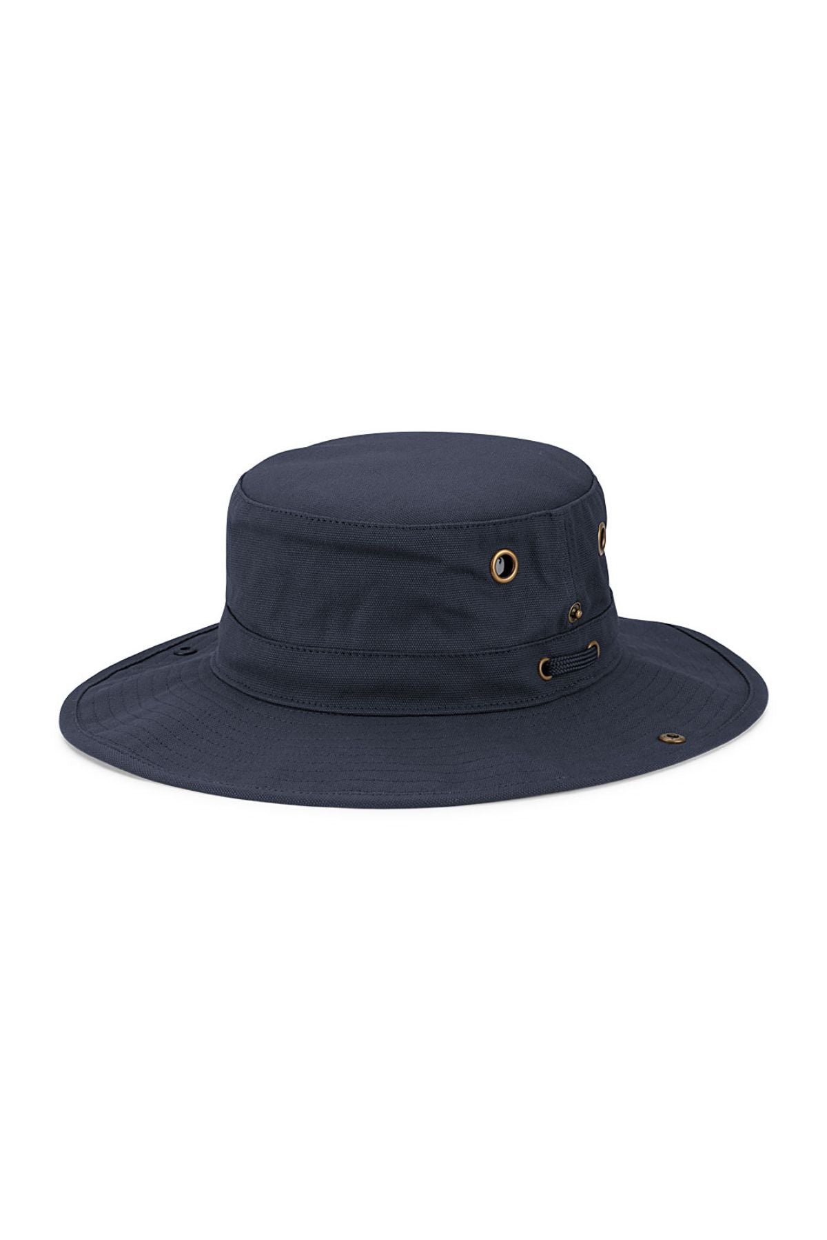 The Avenel Kokoda Cotton Canvas Hiker is a navy blue wide-brim cotton hat with metal eyelets and a small logo tag on the brim, offering UPF50+ sun protection—ideal for outdoor activities.