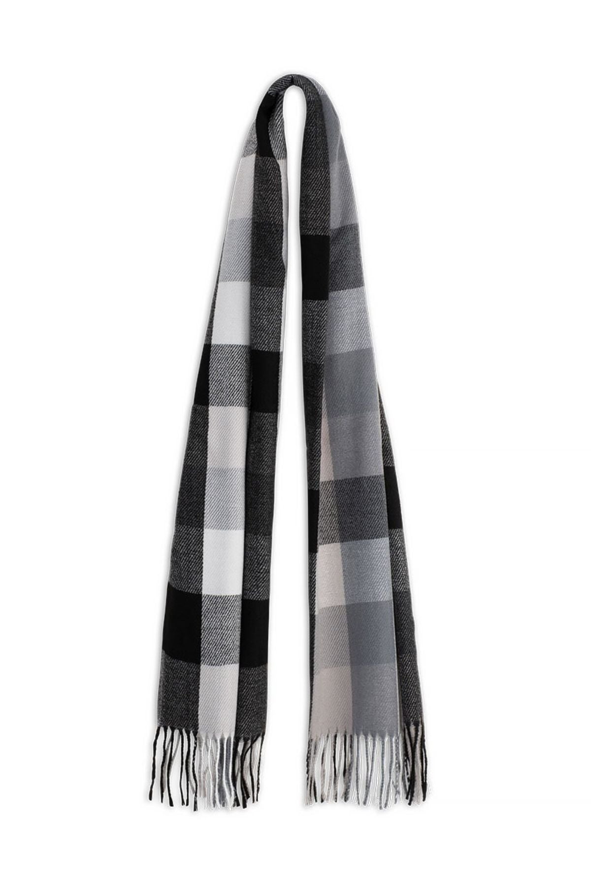 The Avenel Piper Wide Check Scarf is a long rectangular accessory in black, white, and gray plaid with fringed ends, made from super soft polyester. Shown on a plain white background.