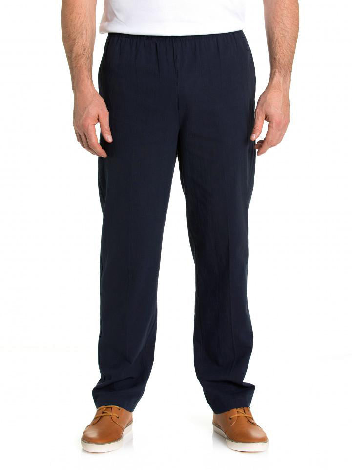 A man wearing Breakaway Crinkle Pants with an elastic waist and comfortable shoes.