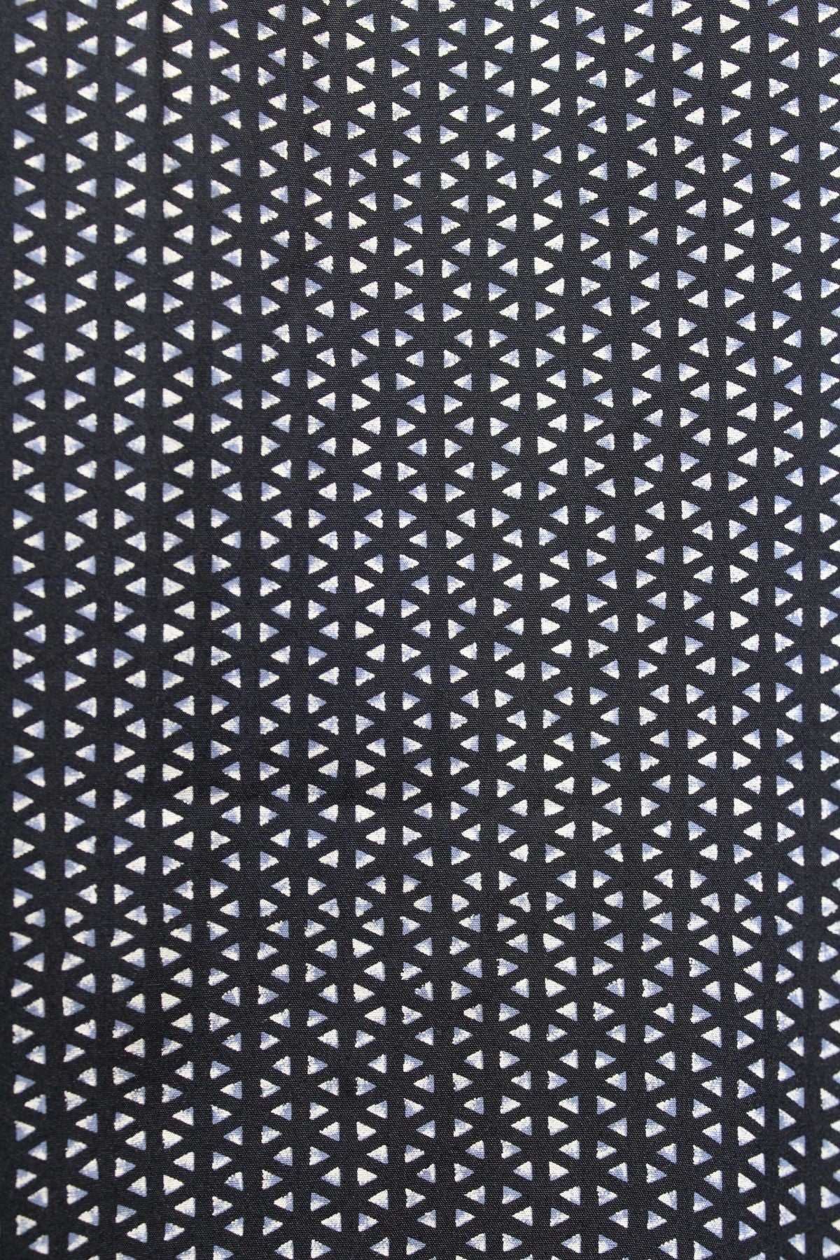 The Back Bay Bamboo Soft Touch Print Short Sleeve Shirt features a striking geometric pattern of white and light purple triangles on black, crafted from a soft polyester-cotton blend for comfort and style.