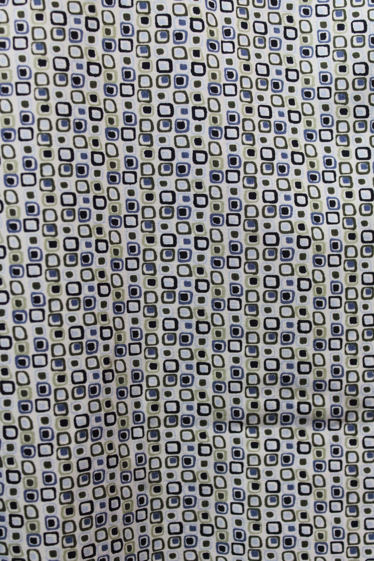 A close-up of fabric with small, overlapping black, blue, and beige square outlines on a light background. This geometric, retro-style print is perfect for the Back Bay Bamboo Soft Touch Print Short Sleeve Shirt.