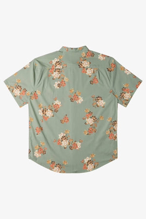 The Billabong Sundays Mini Short Sleeve Shirt features a bold floral print in orange, white, and pink on a light sage green background, displayed flat to show the back side.