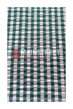 A green and white checkered fabric, inspired by the Bisley Countryman Seersucker Short Sleeve Shirt, featuring the words “MAINSTREET clothing destination” subtly printed in pink across the center.