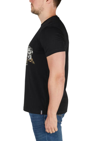 A man in profile facing left wears the Bullzye Dusk Tee, a black cotton jersey t-shirt with a white chest graphic, paired with blue jeans against a plain white background.