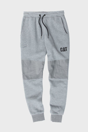 The CAT TM Fleece Track Pant features a light gray fleece, tapered fit, ribbed cuffs, elastic waistband with black drawstring, side pockets, dark gray reinforced knee patches, and bold CAT branding on the left thigh.