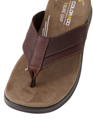 Close-up of the Colorado Incara Leather Thongs: brown leather thong sandal with visible stitching, memory foam footbed for comfort, black slip-resistant sole, and "COLORADO SURE GRIP" branded on the insole.