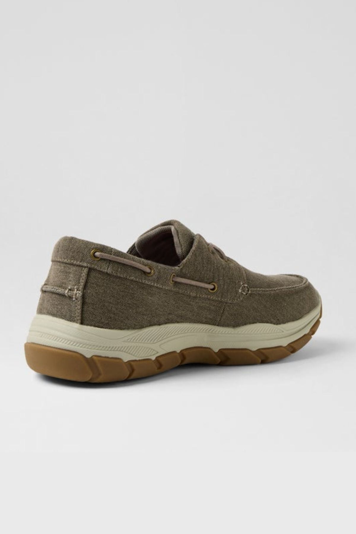 A single Colorado Kanebo Canvas Shoe in khaki green with brown laces, white stitching, and a thick beige rubber sole offering arch support is displayed at an angle against a plain light gray background.
