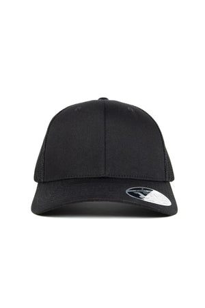 The FlexFit MT Mesh Trucker Cap, shown from the front, features a plain black design with a curved brim, breathable mesh back, and an adjustable snapback for a perfect fit. A sticker is visible on the brim.
