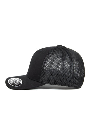 The FlexFit MT Mesh Trucker Cap, shown from the side against a white background, features a black mesh back for breathability, a flat bill with a sticker on the brim.