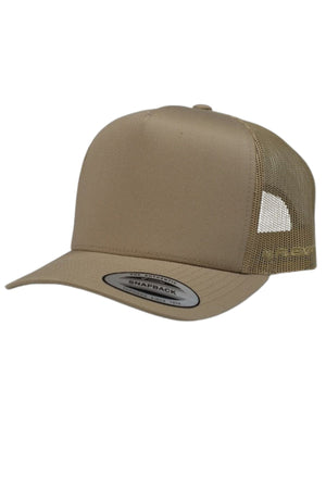 The FlexFit Trucker Cap features a tan solid fabric front, breathable mesh back and sides, a curved brim with a "Snapback" sticker, and an adjustable snapback closure.