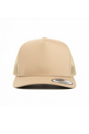 The FlexFit Trucker Cap is a beige hat with a curved brim, mesh back panels, and a front sticker, displayed front-facing against a white background. It includes an adjustable snapback closure for a comfortable fit.