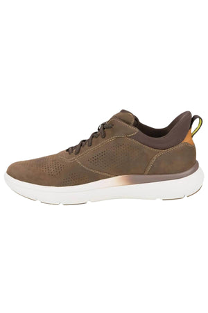 The Florsheim Fleet Perf Sneaker is a brown athletic shoe with a white sole, SupaStep design, side perforations, dark brown laces, and a yellow heel pull tab, shown in side profile.