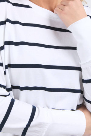 Wearing the Foxwood Farrah Stripe Long Sleeve in soft Pima Cotton, a person with their face partially out of frame rests their hand thoughtfully on their chin.