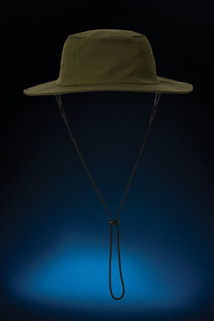 The FXD CP-14 Boonie Hat, in olive green with a chin strap, is designed for outdoor work and sun protection. Itโs shown against a dark background with blue light below, highlighting its shape and details.