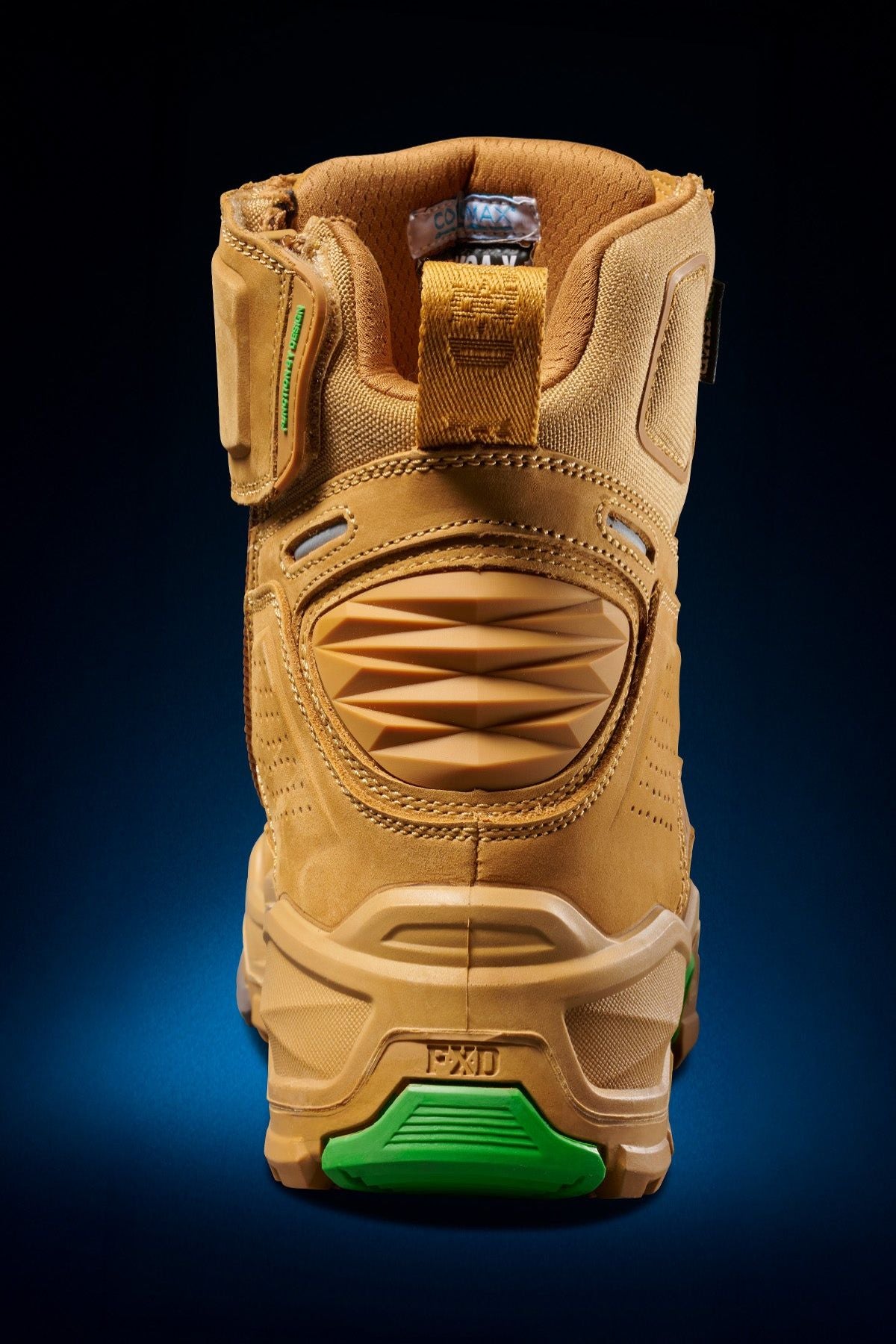 The FXD Dura X-1 Nitrocore™ High Cut, High Performance Work Boots are shown from the back in tan and green, featuring textured panels, a heel pull tab, and a sturdy sole against a dark blue gradient background.