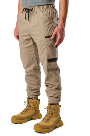Someone dressed in FXD WP-12C stretch ripstop work pants and boots.