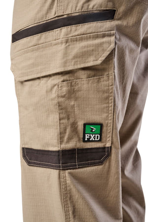 Close-up of the side utility pocket on FXD WP-12 light brown work pants with dark brown trim, white stitching, and a green and black FXD logo patch.